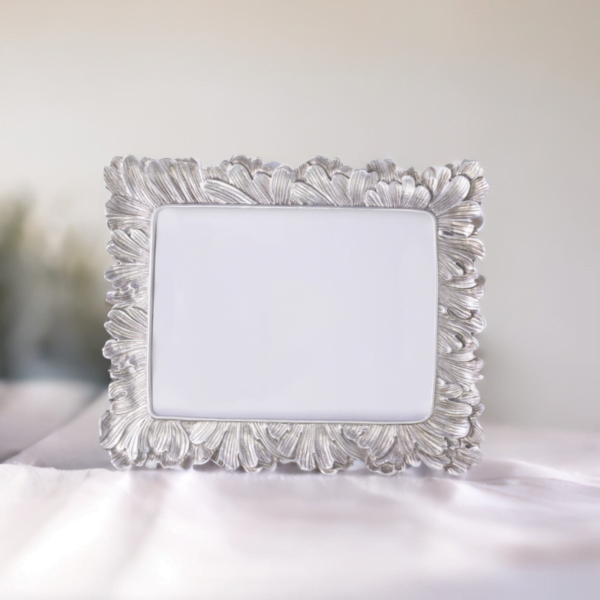 A Vintage Silver Photo Frame on a white table.