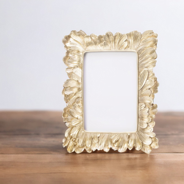 A Vintage Gold Frame on a wooden table.