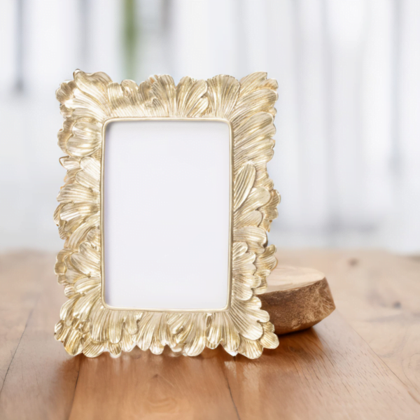 A Vintage Gold Frame on a wooden table home accessories