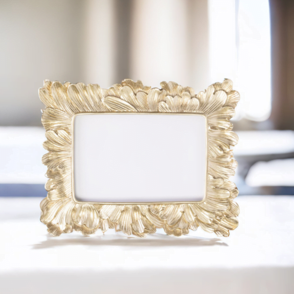 A Vintage Gold Frame on a table in a room. Great for interior decorating ideas
