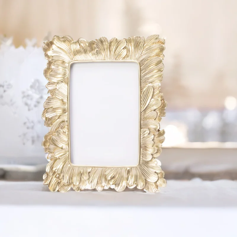 A gold frame adorned with leaves on a London table.