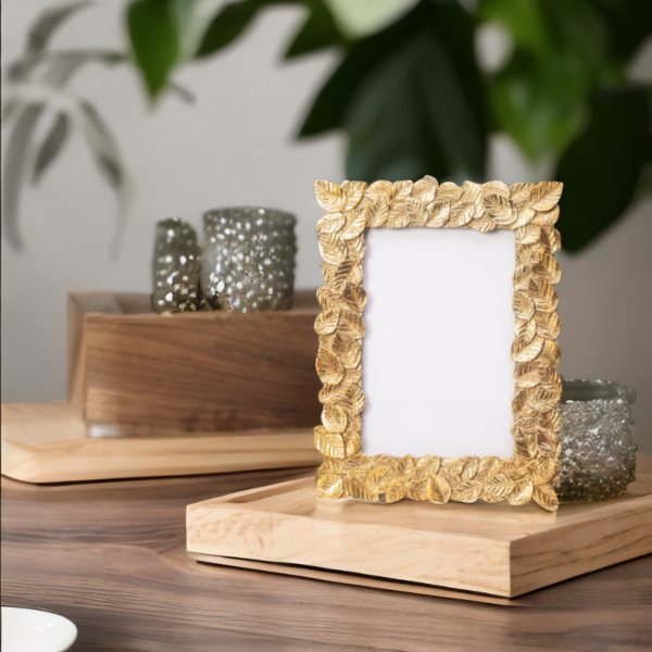 Gold Leaf Photo Frame on a wooden table.