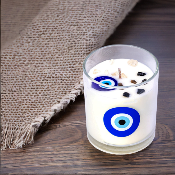 A Evil Eye Cotton Flower Candle with an evil eye on it.