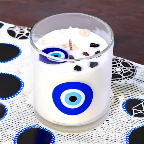 Evil Eye Lavender Amber Soy Candle with an evil eye on it.