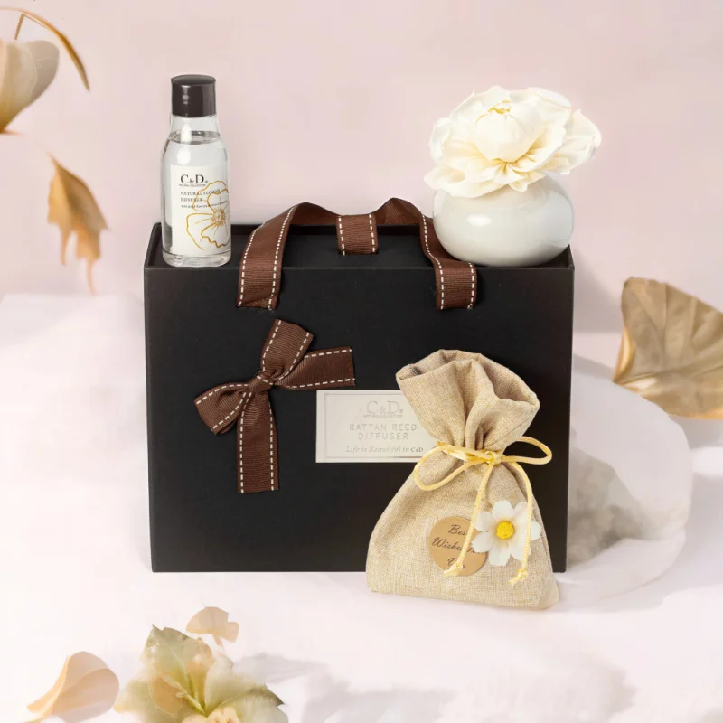 A black Luxury Diffuser Gift Set gift box set, It includes a beautifully designed glass diffuser bottle, a set of natural reed sticks, and a 50ml bottle of premium fragrance oil in a luxurious scent.