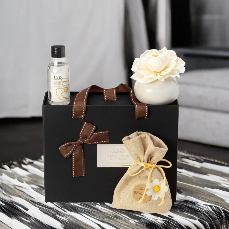 A black Luxury Diffuser Gift Set gift box set, It includes a beautifully designed glass diffuser bottle, a set of natural reed sticks, and a 50ml bottle of premium fragrance oil in a luxurious scent.