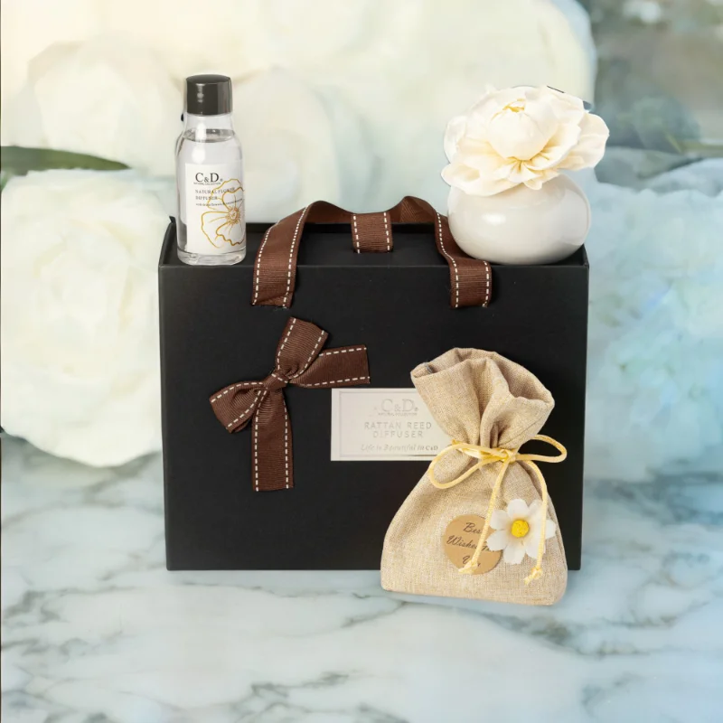 A black Luxury Diffuser Gift Set gift box set, It includes a beautifully designed glass diffuser bottle, a set of natural reed sticks, and a 50ml bottle of premium fragrance oil in a luxurious scent.