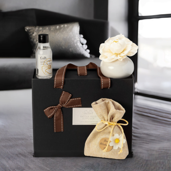 A black Luxury Diffuser Gift Set gift box set, It includes a beautifully designed glass diffuser bottle, a set of natural reed sticks, and a 50ml bottle of premium fragrance oil in a luxurious scent.