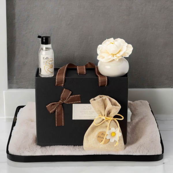 A black Luxury Diffuser Gift Set gift box set, It includes a beautifully designed glass diffuser bottle, a set of natural reed sticks, and a 50ml bottle of premium fragrance oil in a luxurious scent.