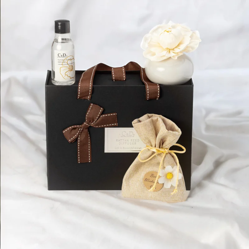 A black Luxury Diffuser Gift Set gift box set, It includes a beautifully designed glass diffuser bottle, a set of natural reed sticks, and a 50ml bottle of premium fragrance oil in a luxurious scent.