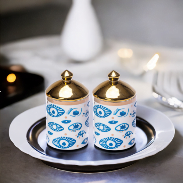 Two Luxury Evil Eye Canisters (Set of 2) on a plate.