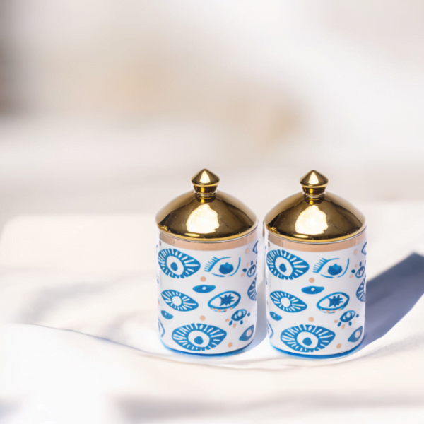Two Evil Eye Canister (Set of 2) on a white table.