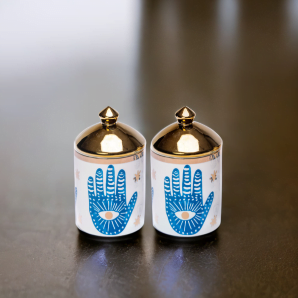 A pair of blue and white and blue Canisters (Set of 2) with a hamsa hand on them.and gold lids.