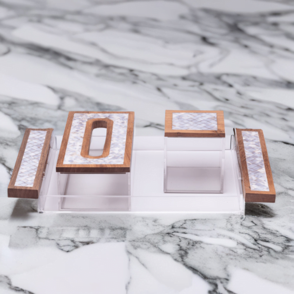 Premium acrylic and mother of pearl set, includes Tray, tissue box and a cube storage box sitting on a marble top.