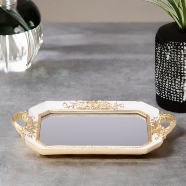 A white octagon tray with a mirror bottom and gold accents.