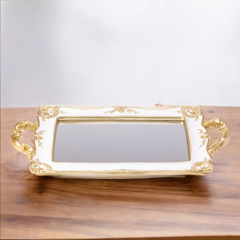 A French Mirror tray on a wooden table.