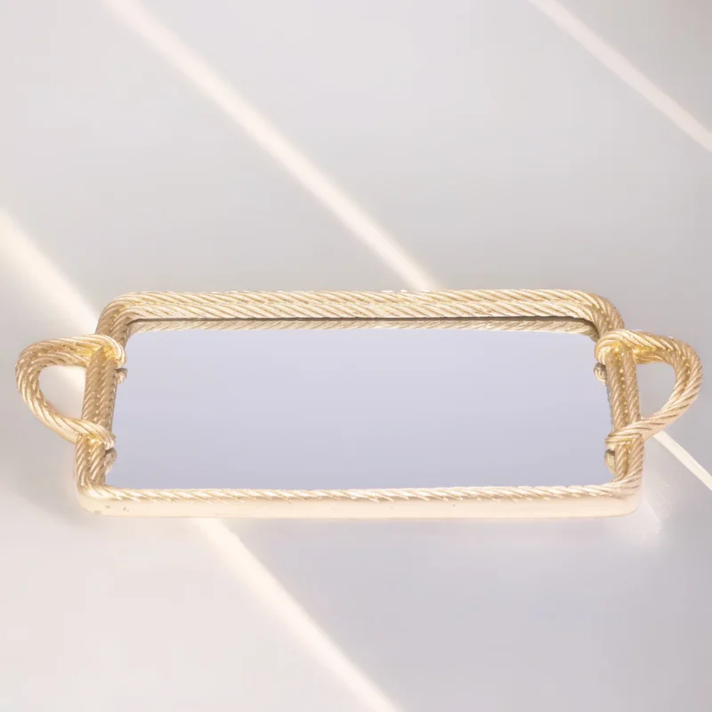 A Twisted Tray with a mirror on it.