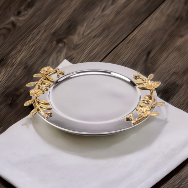 An Alia Tray with gold leaves on a napkin.