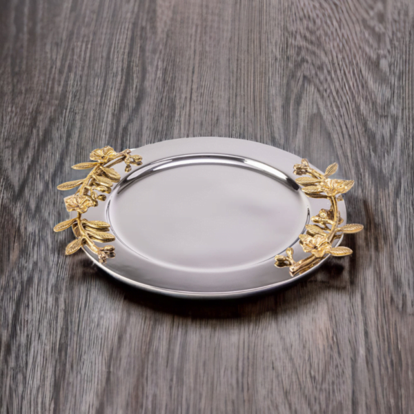 Alia stainless steel tray styled with gold leaves on wooden surface.