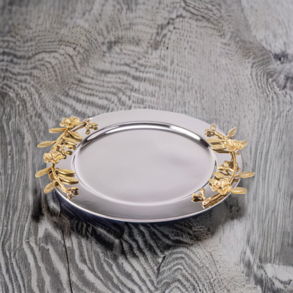 Alia stainless steel tray styled with gold leaves.