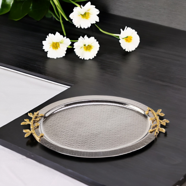 A Leaf Oval Tray on a table with flowers on it.