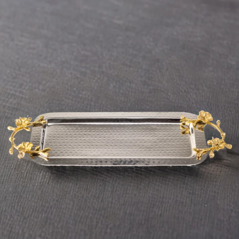 A Long Floral Tray with gold and silver accents.