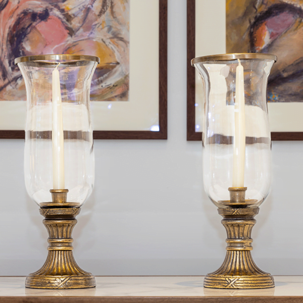 Two Large golden candle holders with glass