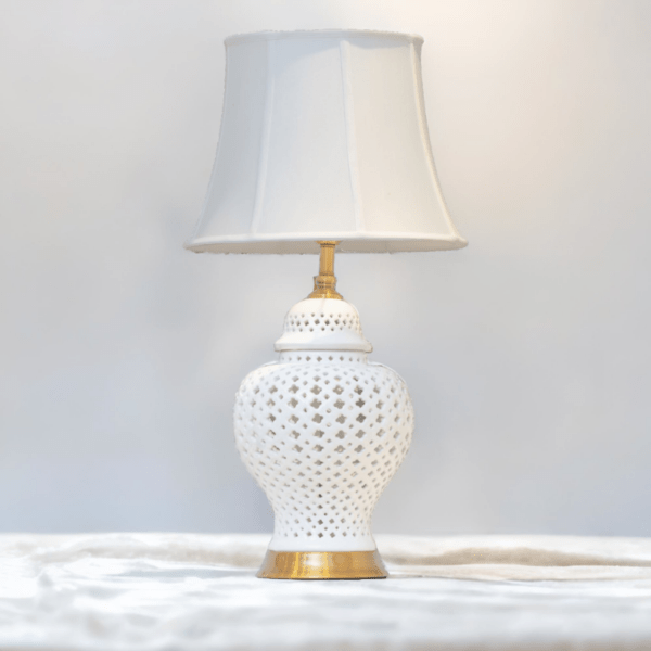 White Ginger Jar Lamp with white shade on a marble top.