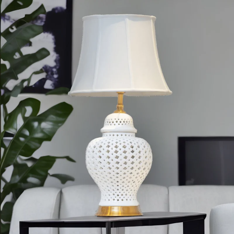 White Ginger Jar Lamp with white shade on a living room table.