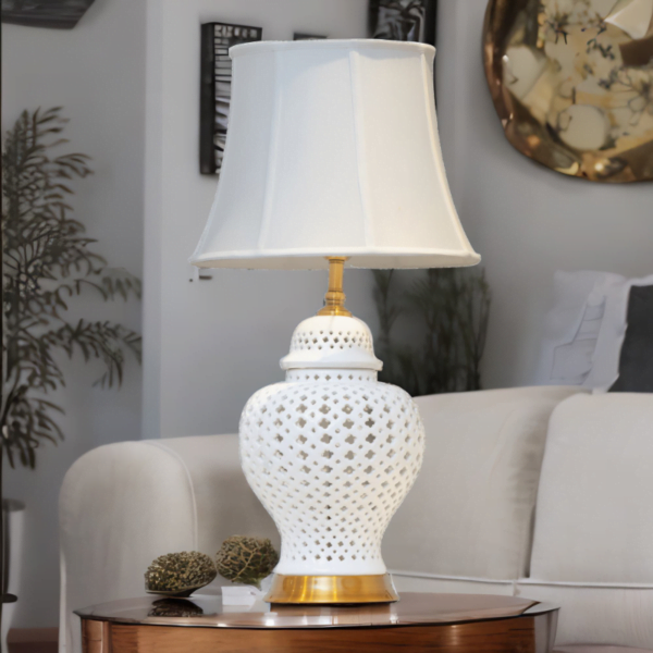 White Ginger Jar Lamp with white shade on a living room table.