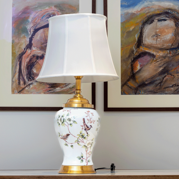 White lamp with gold accents and painted flowers and birds