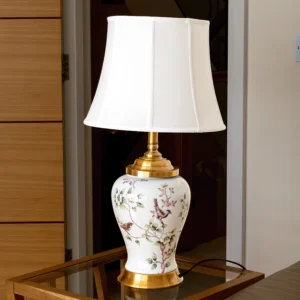 White lamp with gold accents and painted flowers and birds