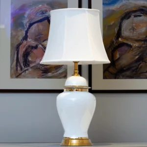 Solid white lamp wit white shade.