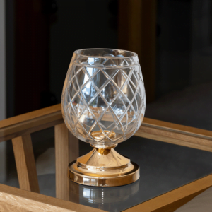 Beautiful candle holder in a very elegant mix between gold metal and glass