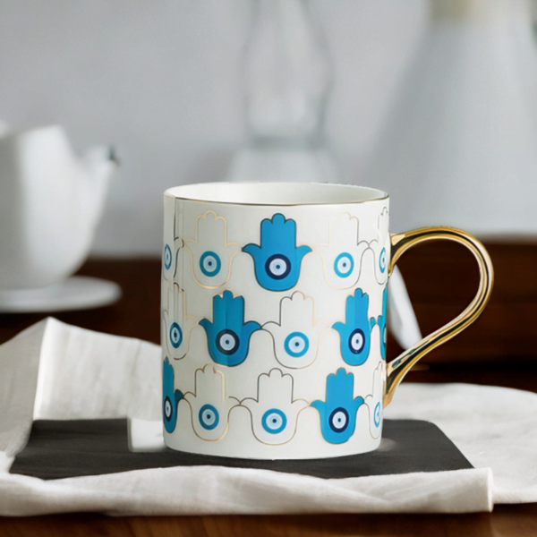 An Azure Hamsa Hand Mug, Blue and White with Gold accents in London living room.