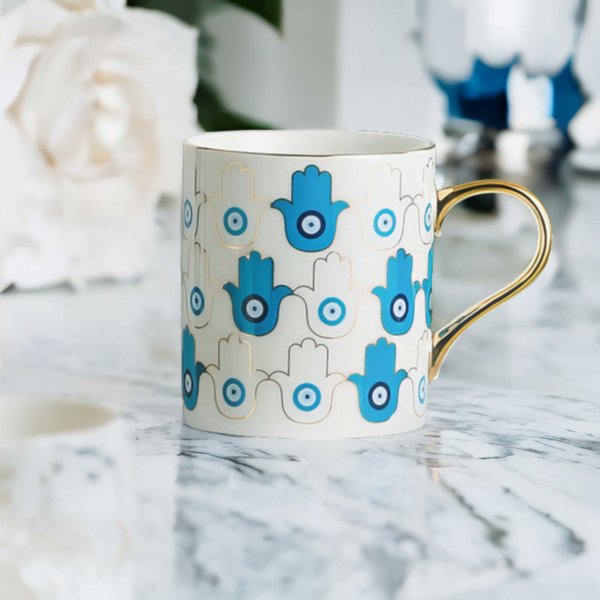 An Azure Hamsa Hand Mug, Blue and White with Gold accents interior design ideas.