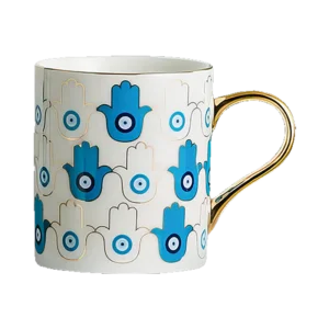 An Azure Hamsa Mug with a hamsa hand on it.