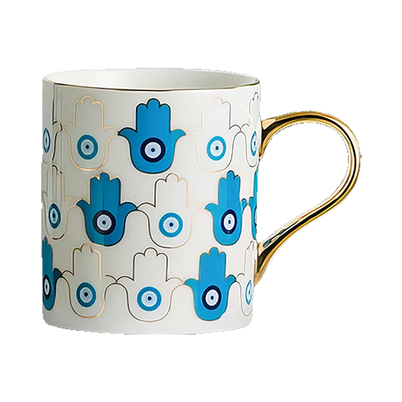 An Azure Hamsa Mug with a hamsa hand on it.
