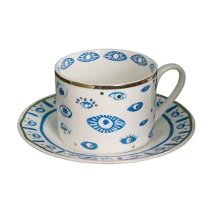 An Evil Eye Blessing Set cup and saucer with a blue and white design.