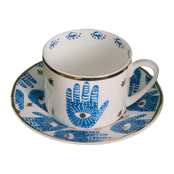 A blue and white Hamsa Blessings Set cup and saucer.