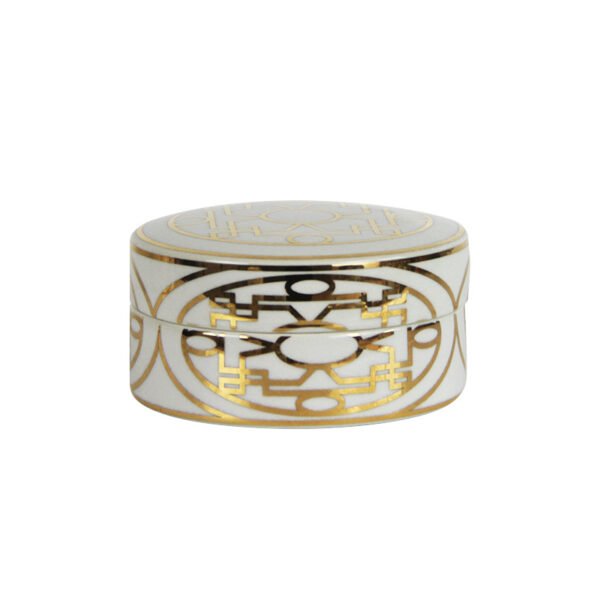 small ceramic canister with gold accents