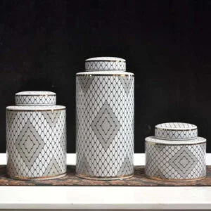 3 jar set diffrent sizes with matching lids, elegent mix of white and blabk mix with a hits of grey colors to elevate your home decor and the gold edges