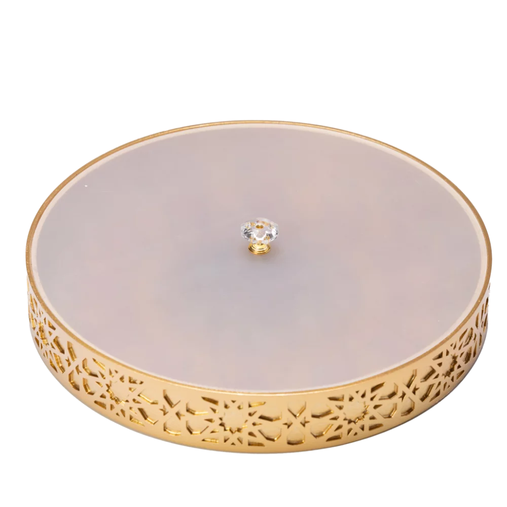 A vibrant gold decorative tray with an intricate and colourful design with frosted white lid.