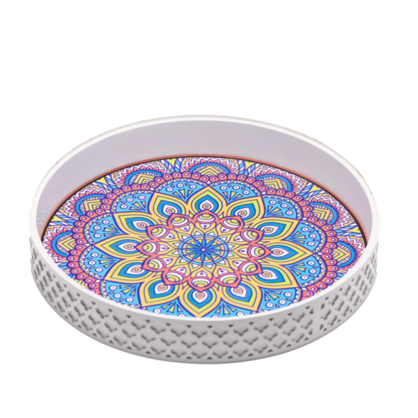 a white decorative tray styled with vibrant patterns.