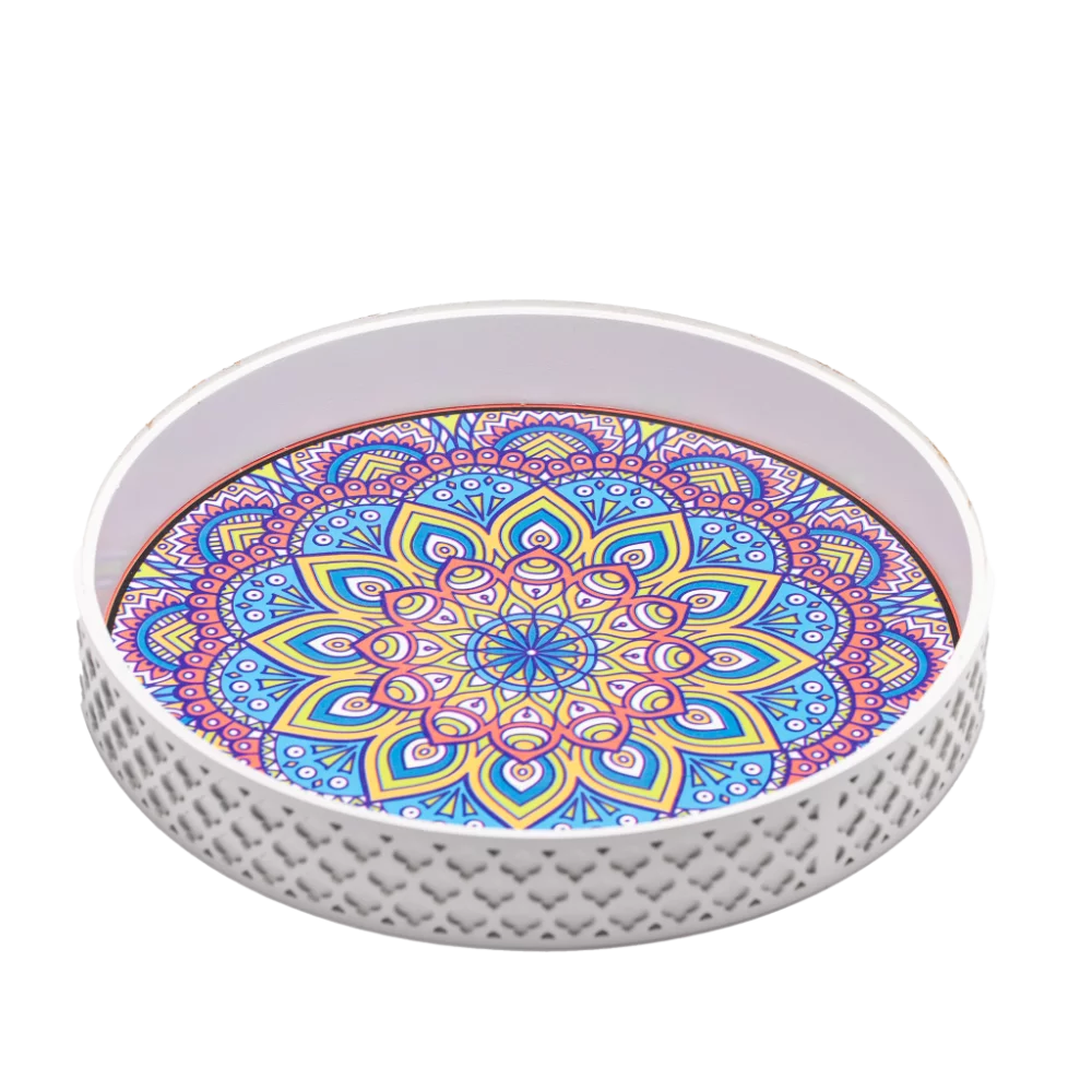 a white decorative tray styled with vibrant patterns.