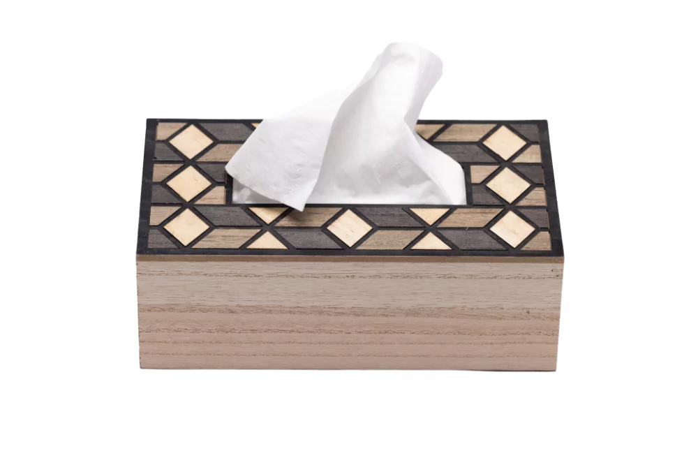 wooden tissue box with mosaic pattern design and a tissue inside it.