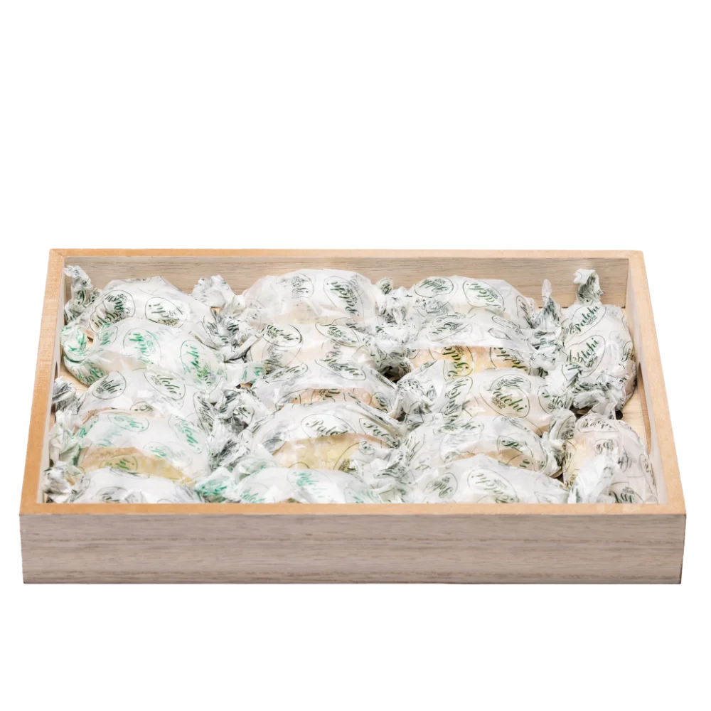 wood serving tray filled with arabic sweets.