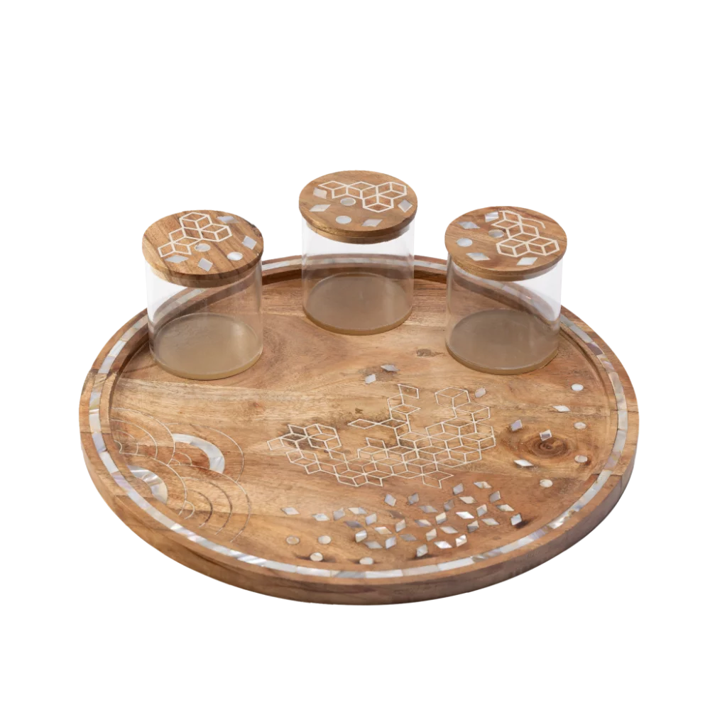 round wooden tray with 3 canisters adorned with mother of pearl inlay.