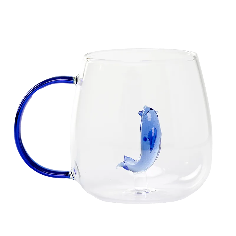 Glass cup with blue handle and 3D blue dolphin inside