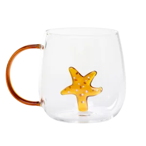 Glass cup with orange handle and 3D orange starfish inside
